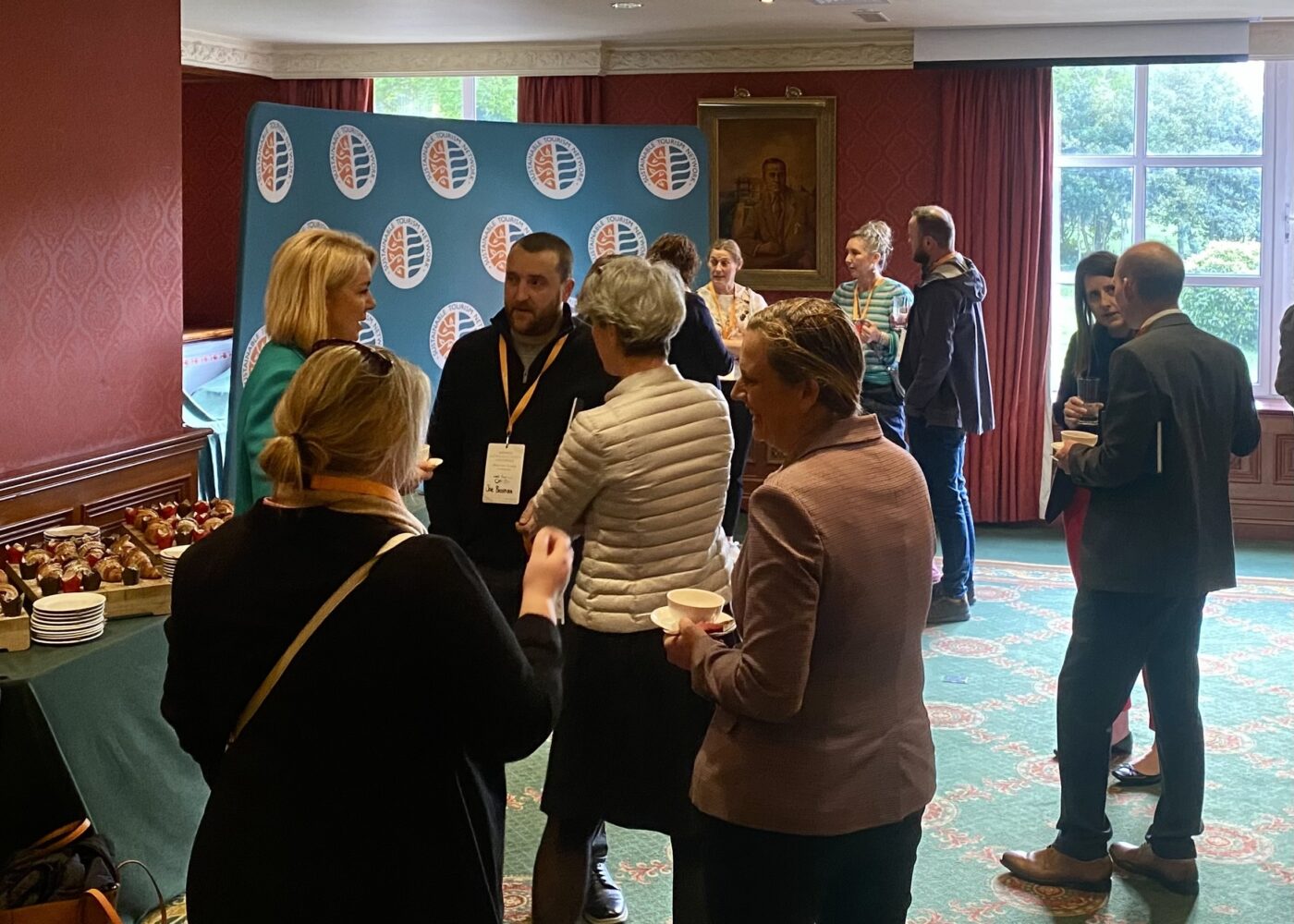 Group of people chatting and networking in a room
