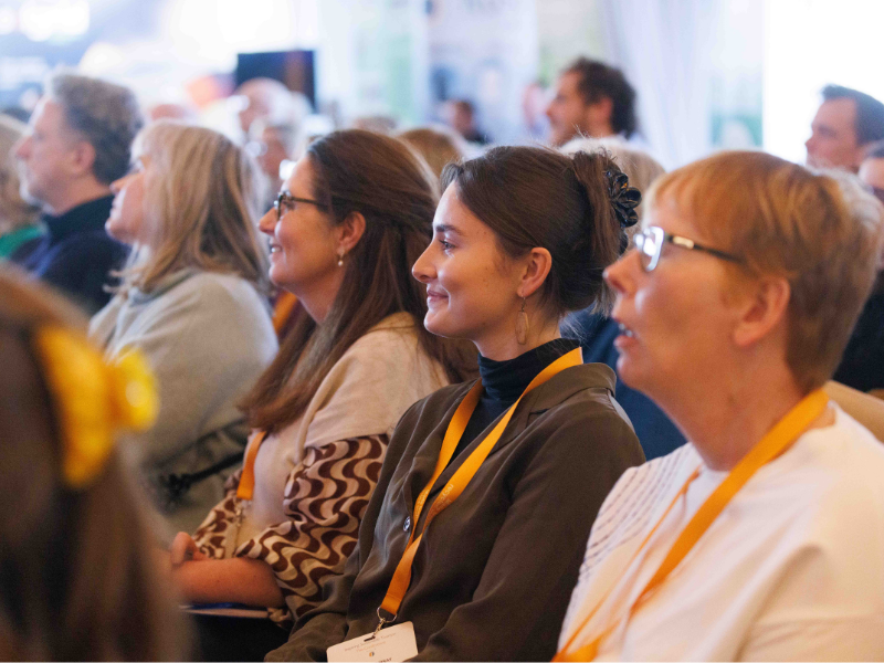 Sustainable Tourism Network Conference 2025 - attendees smiling towards stage