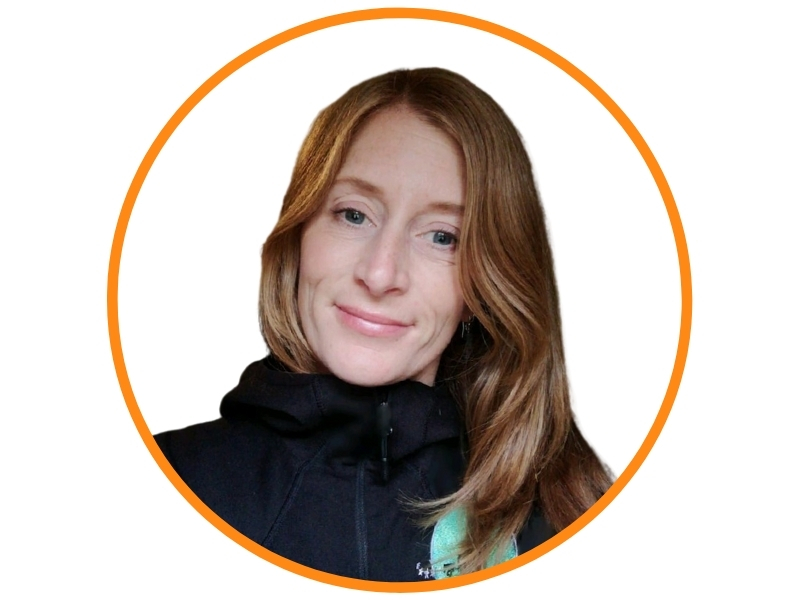 Edwina Horgan Sustainability Consultant & Coach Smiling red haired girl wearing a black jumper