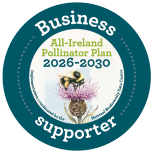 Business supporter logo for the All-Ireland Pollinator Plan 2026 - 2030. Image of bee pollinating on a flower in the middle and teal border with white writing around. Sustainable Business Network.