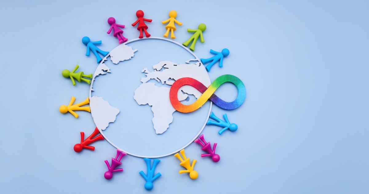 Image of world with coloured cut out paper people holding hands united around it and a multicoloured infinity sign